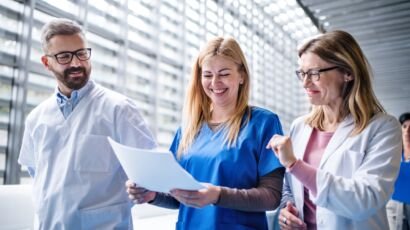 Group of doctors walking in corridor on medical conference