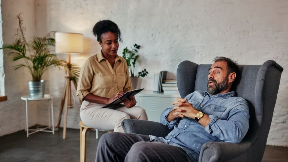 Middle age talking with mental health psychotherapist