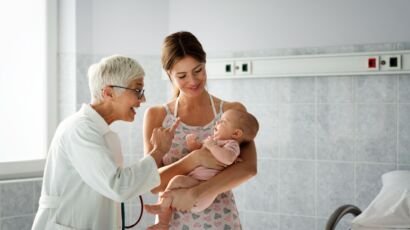 Pediatric doctor exams little baby. Health care, medical examination, people concept