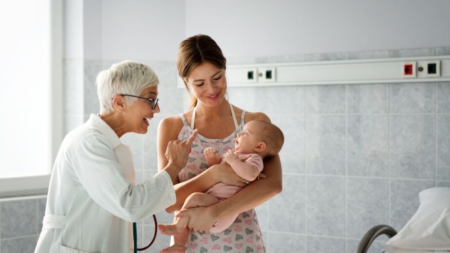 Pediatric doctor exams little baby. Health care, medical examination, people concept
